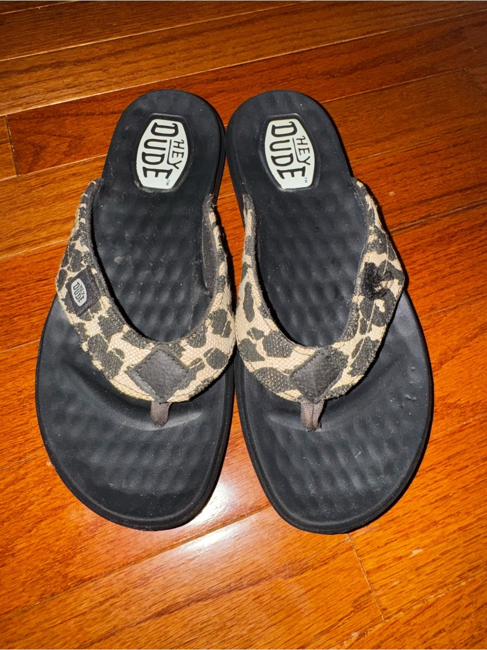 Hey Dude Women’s Black Flip Flops with Leopard-Print Straps
